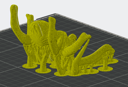 Sliced 3D spider model preview showing tree supports and brim pads on a build plate in slicer software.